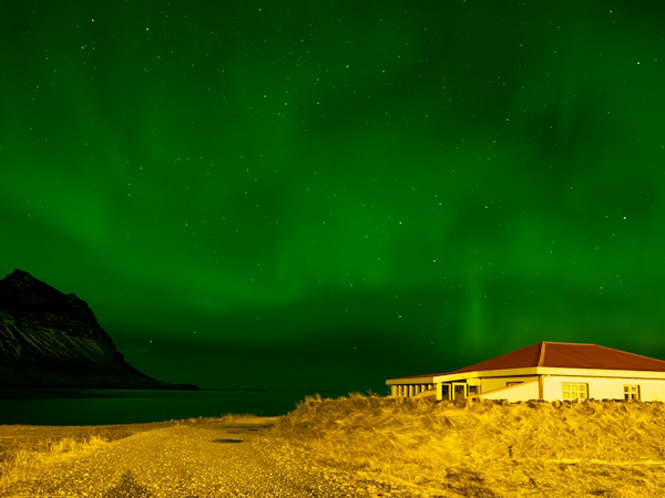 Hellnafell Guesthouse under the northern lights.