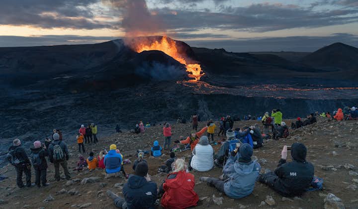 Tourists enjoying the eruption of Fagradalsfjall volcano.