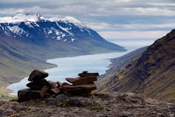 The beautiful Mjoifjordur fjord in East Iceland is surrounded on both sides by spectacular mountains.