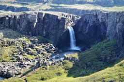 Folaldafoss waterfall, seen in this photo, is one of the waterfalls along Oxi pass, including Haenubrekkufoss.