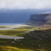 Orlygshofn beach, in the Westfjords, has a fantastic setting and is surrounded by magnificent cliffs.