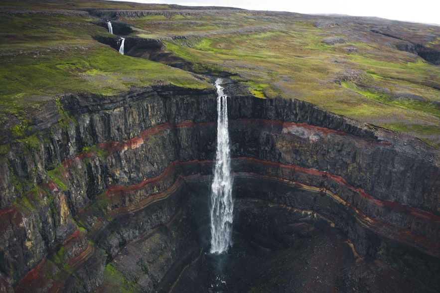 Hengifoss waterfall of Iceland cascading beautifully from its tall cliff.