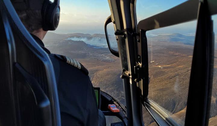 An expert pilot driving a helicopter over Iceland.