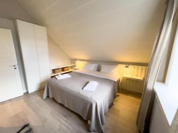 Travelers would feel comfortable staying at Kristinsson Apartment's bedroom one with a large bed.