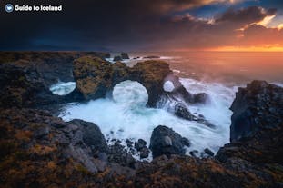 The nature of Iceland has helped form the Gatklettur Arch of Snaefellsnes Peninsula.