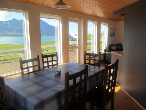 The private cottage has a dining area with stunning fjord views.
