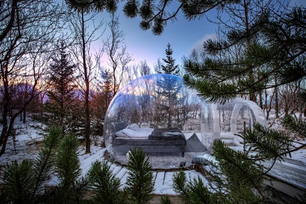 The unique transparent igloo available at Eyja Mork is perfect for stargazing or northern lights viewing.