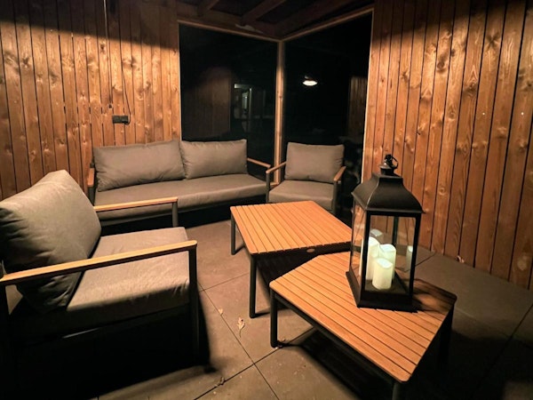 The patio with outdoor furniture is a comfortable place to relax.
