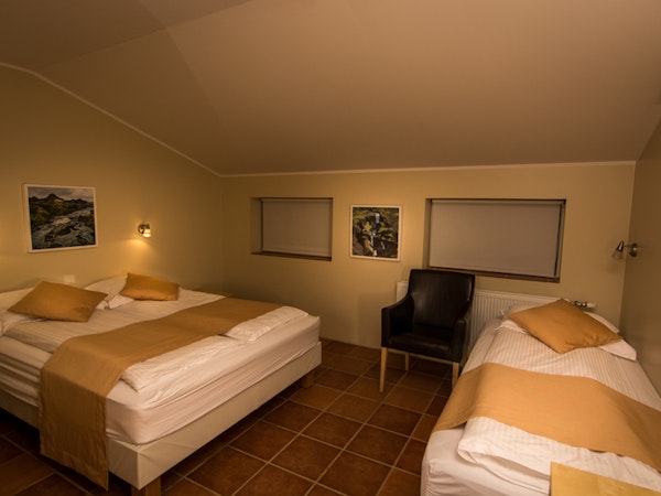 A triple room at Hotel Natur has a single bed and a large double bed, perfect for a group of three.
