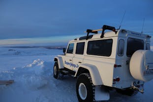 A super jeep on an icy surface in Iceland.