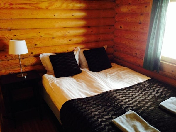 Brimnes Cabins' family cottage has a room with a double bed.