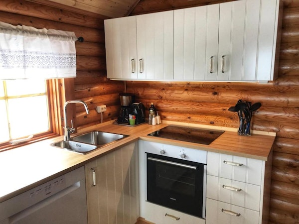 The family cottage of Brimnes Cabins has its own kitchen with coffee maker and a stove.