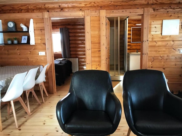 Brimnes Cabins' shared area has enough chairs and tables for a group of up to seven people.