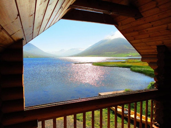 Brimnes Cabins' terrace offers a beautiful mountain and lake view.