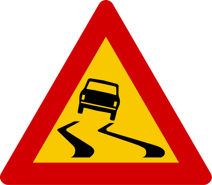 A yellow triangular Icelandic road sign indicating the road is slippery when wet.