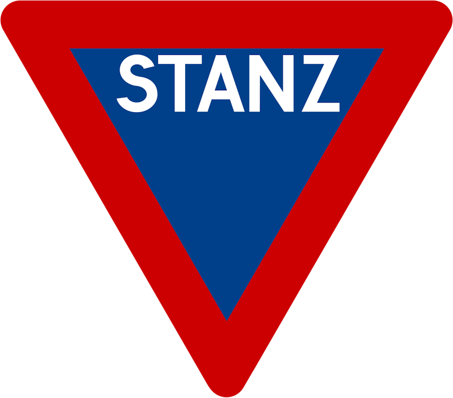 An outdated stop sign in Iceland with an upside-down triangle shape, a red border, blue background, and the word STANZ on it.