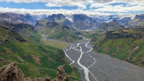 Glacial rivers snake through the valley in the Thorsmork nature reserve, while jagged mountain peaks tower all around.