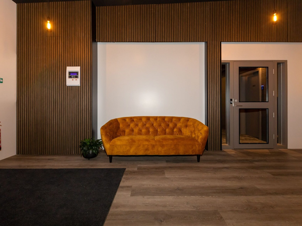 Hotel Halond's lobby has a sofa to welcome guests.