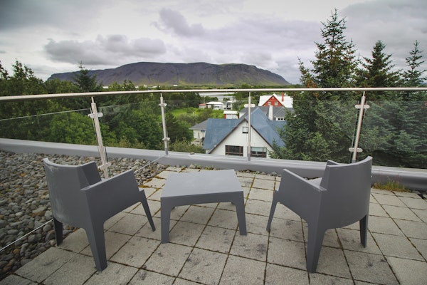 The rooftop terrace of the penthouse apartment at Bella Hotel with a wonderful view over the mountains.