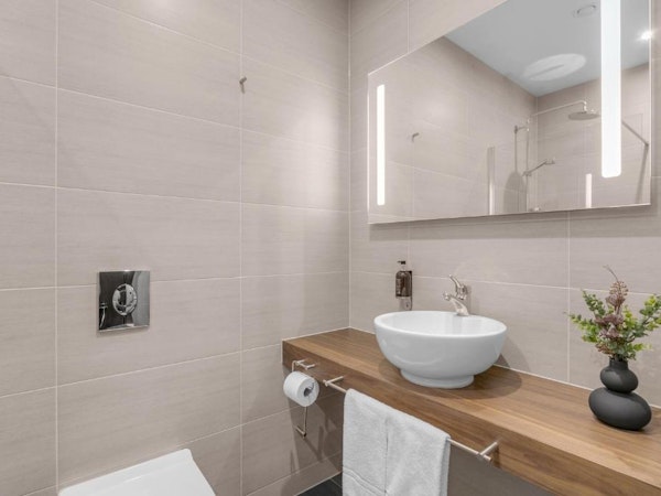 An en-suite tiled bathroom at the Alva Hotel.