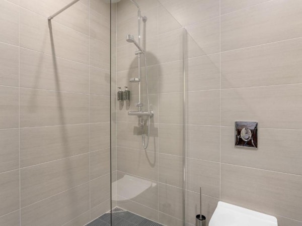 The neutrally decorated shower in one of the hotel rooms.