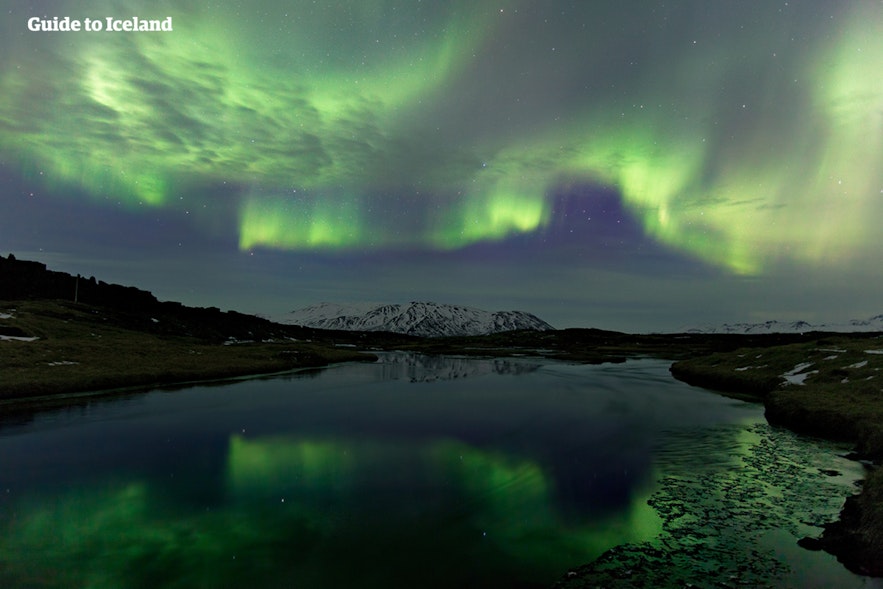 The beautiful northern lights at Silfra fissure in Iceland.