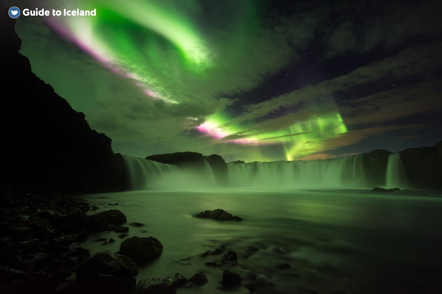 Godafoss waterfall (Waterfall of the Gods) in North Iceland, under the northern lights.