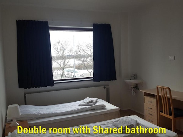 The double room at Travel Inn Guesthouse has a large window with nice views of Reykjavik.