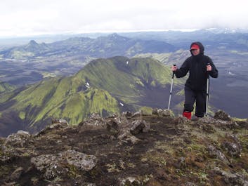 Person hiking with poles in the Thorsmork valley.