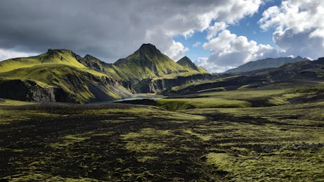 The spectacular Thorsmork valley with mountains and lush vegetation.