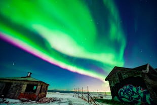 The aurora borealis lights up the winter night sky near Reykjavik in a dazzling splash of color.