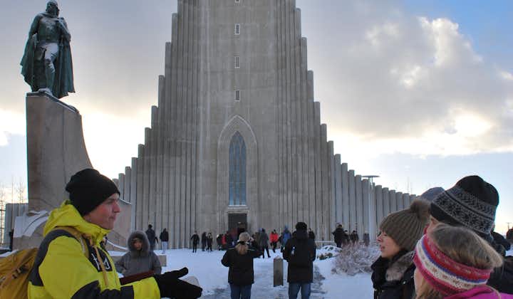 A tour group outside the Hallgrimskirja church in Reykjavik in the winter.