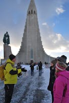A tour group outside the Hallgrimskirja church in Reykjavik in the winter.