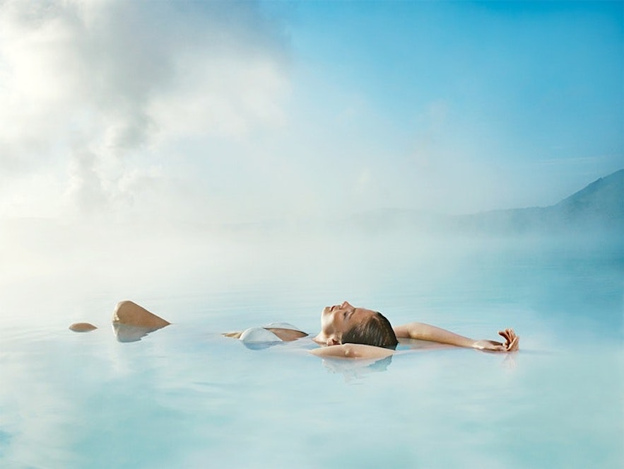 A woman floats in the Blue Lagoon