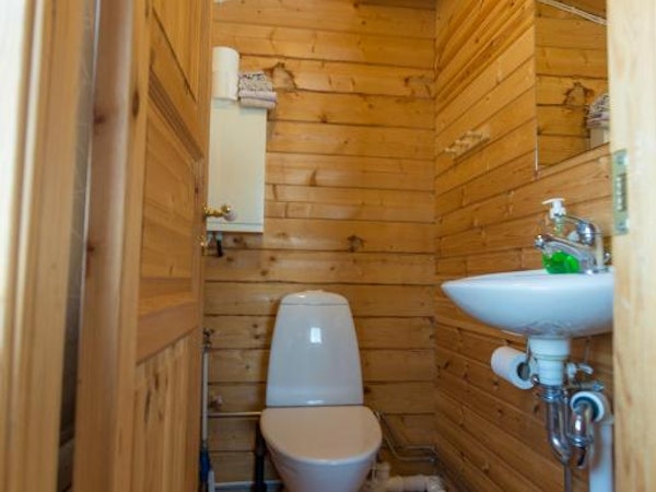 One of the bathrooms at Gladheimar cottages with a sink and toilet.