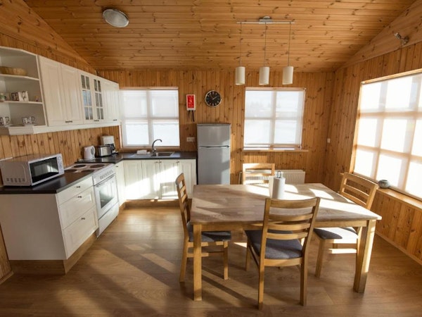 An open-plan kitchen dining area at one of the Gladheimar cottages.