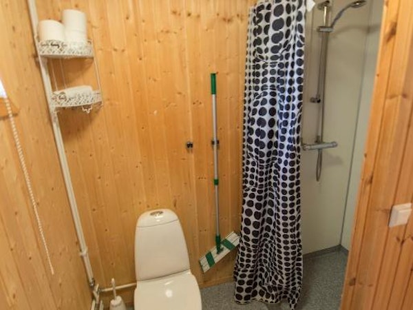 One of the bathrooms at Gladheimar cottages, with a toilet and shower.