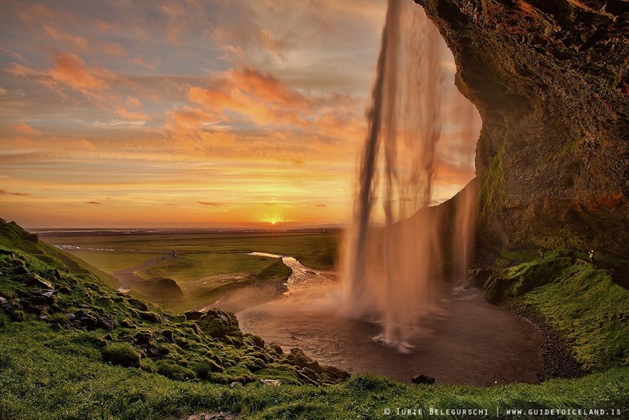 Seljalandsfoss waterfall has a cave behind it that you can walk through, one of the most beautiful attractions in Iceland!