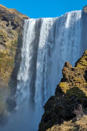 The terrain below Skogafoss waterfall is relatively flat, so you can get close to its majestic beauty.