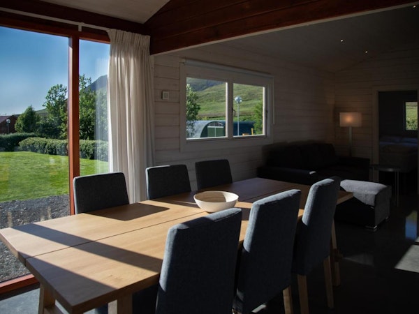 The dining room table in each cabin at Dalasetur seats six people and features excellent nature views out the window.