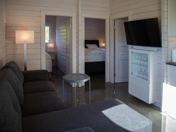 Each cabin at Dalasetur has two bedrooms and a sofa bed in the living area, sleeping up to six people.