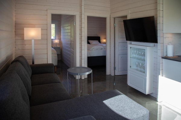 Each cabin at Dalasetur has two bedrooms and a sofa bed in the living area, sleeping up to six people.