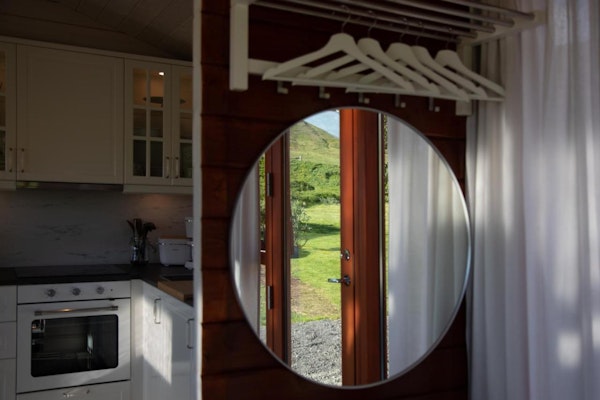 A mirror in a cabin at Dalasetur offers a glimpse at the natural surroundings on the property.