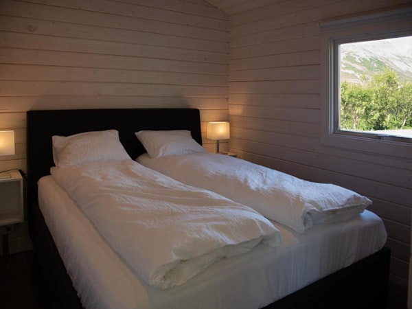 A double bed in one of the bedrooms at Dalasetur near Hofsos in North Iceland.