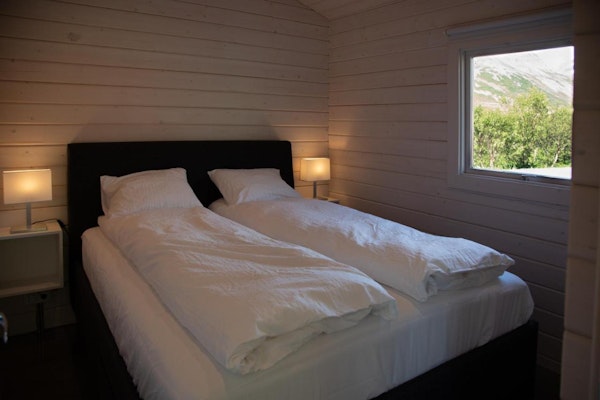 A double bed in one of the bedrooms at Dalasetur near Hofsos in North Iceland.