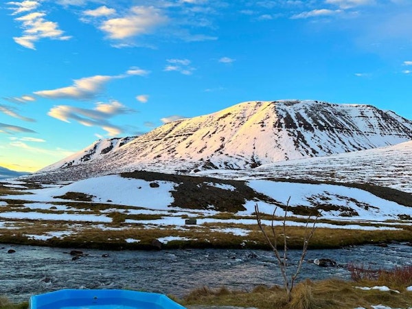 Enjoy a soak in the outdoor jacuzzi at Dalasetur during winter or summer.