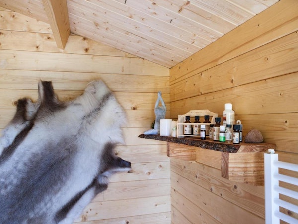 An animal skin on the wall and oils on the shelf at Kalda Lyngholt holiday homes near Lagarfljot river in East Iceland.