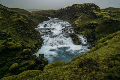 Marvel at rushing waterfalls as you hike through the Icelandic Highlands.