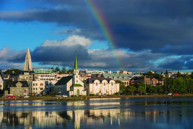 Enjoy the serene beauty of Tjornin lake in the heart of Reykjavik, surrounded by charming landscapes and urban tranquility.