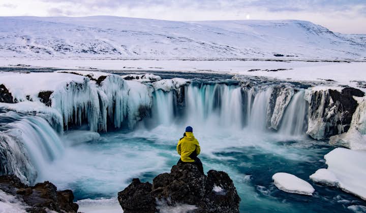 Captivating Frozen Beauty: Godafoss Waterfall in its Winter Splendor.